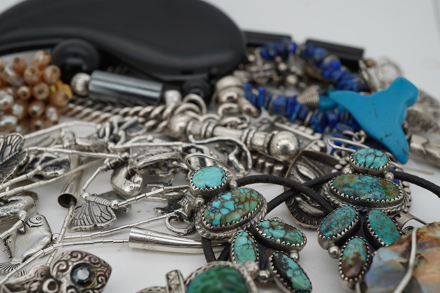 A small quantity of assorted silver and costume jewellery, including a French drop brooch and necklace by Zoe Coste, a rough cut opal set necklace and a pair of silver and turquoise drop earrings by Ron Wesley
